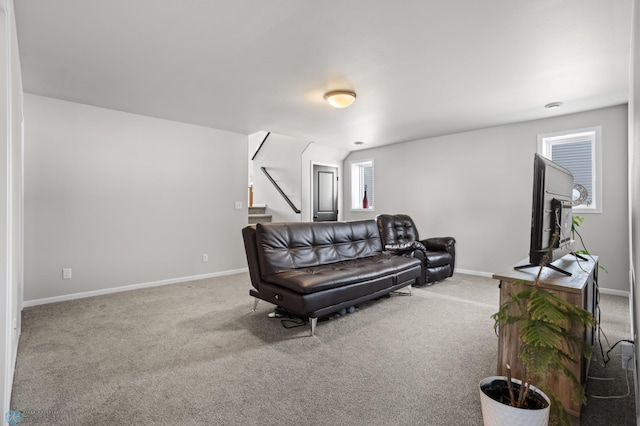 752 Cathy Dr W, West Fargo, ND 58078 - living area featuring stairs, baseboards, and carpet floors
