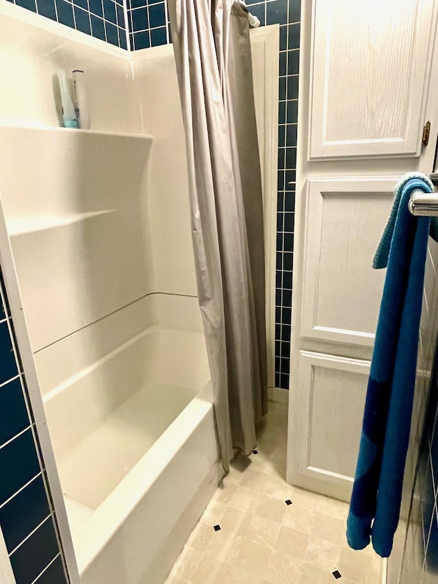 full bath featuring tile walls and tile patterned flooring