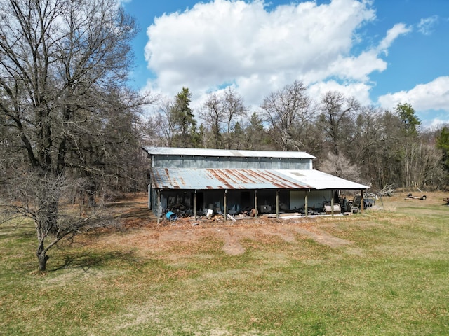 view of pole building with a lawn