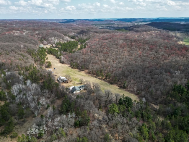 drone / aerial view featuring a view of trees