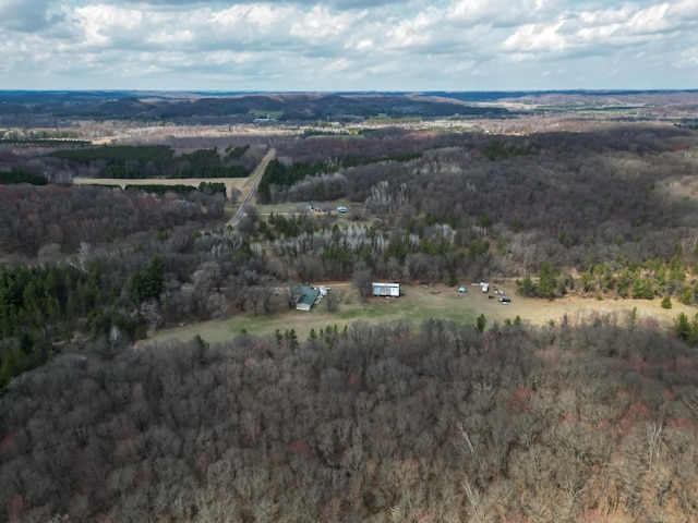 drone / aerial view with a rural view and a wooded view