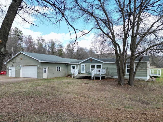 single story home with a front lawn, a deck, roof with shingles, and a garage