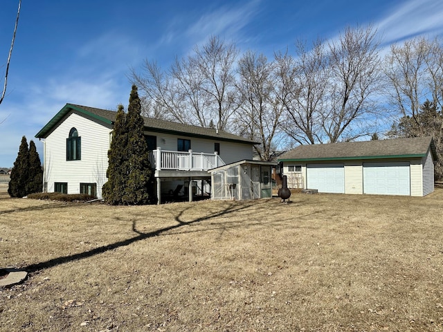 back of house with an outbuilding and a garage