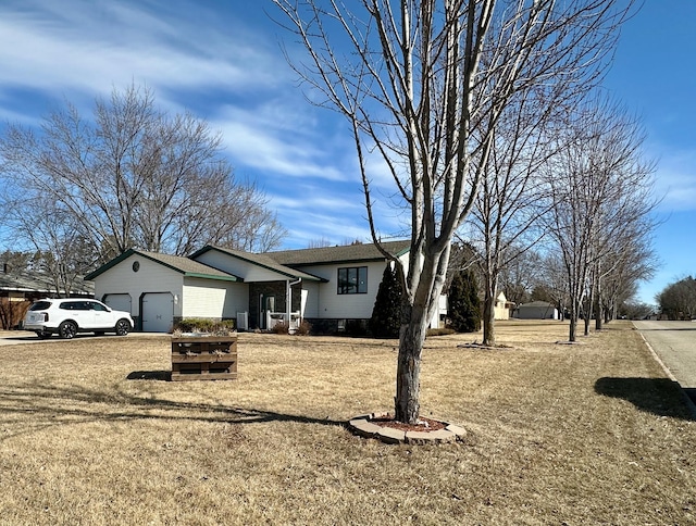 view of front facade with brick siding and an attached garage