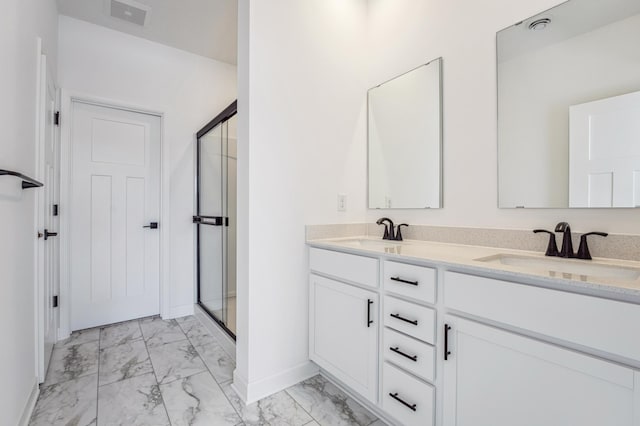 bathroom with marble finish floor, double vanity, visible vents, a sink, and a shower stall