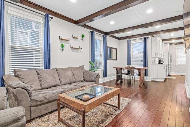 living room featuring recessed lighting, dark wood finished floors, beamed ceiling, and baseboards