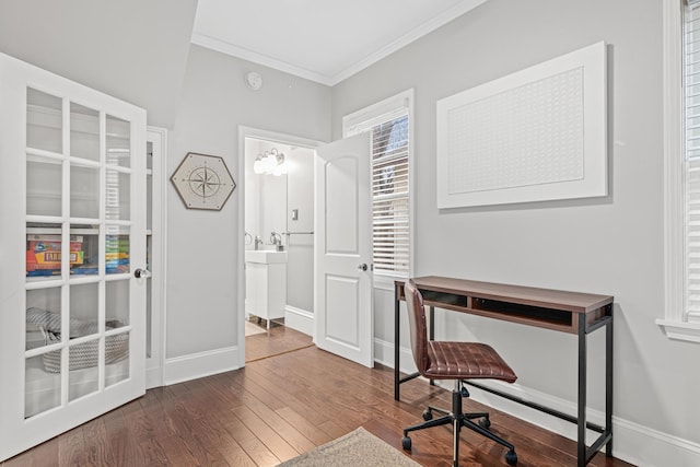 home office with baseboards, hardwood / wood-style floors, and crown molding