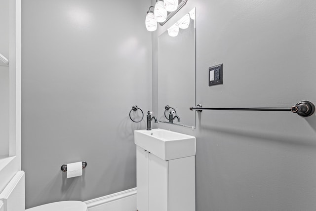 bathroom with toilet and vanity