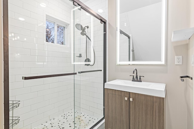 full bathroom featuring a shower stall and vanity