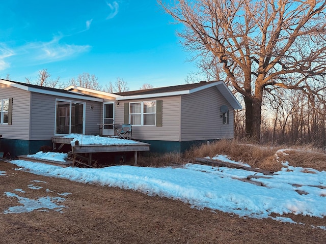 view of snow covered house