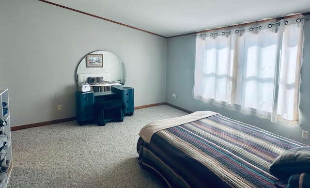 carpeted bedroom with crown molding, baseboards, and a textured ceiling