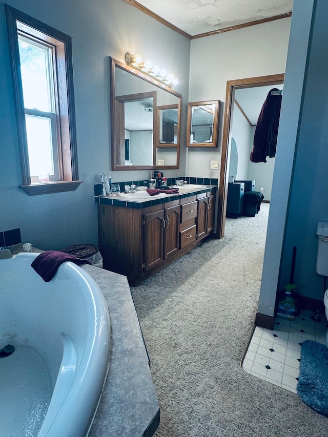 full bath featuring crown molding, double vanity, toilet, a sink, and a bath