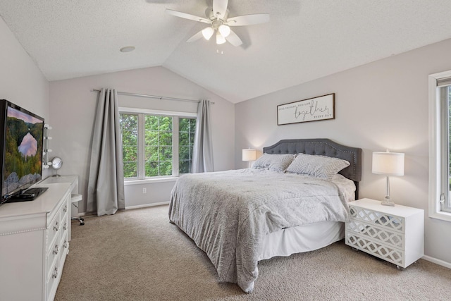 3679 Commonwealth Rd, Woodbury, MN 55125 - bedroom featuring light colored carpet, baseboards, vaulted ceiling, a ceiling fan, and a textured ceiling