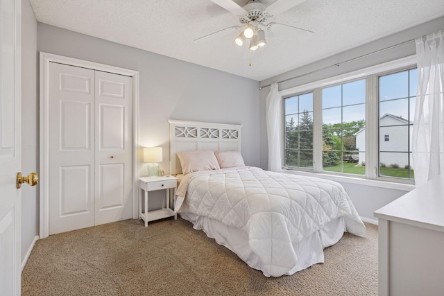 3679 Commonwealth Rd, Woodbury, MN 55125 - carpeted bedroom featuring a textured ceiling and ceiling fan