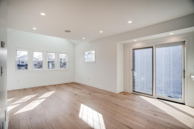 spare room featuring recessed lighting, baseboards, and light wood-type flooring