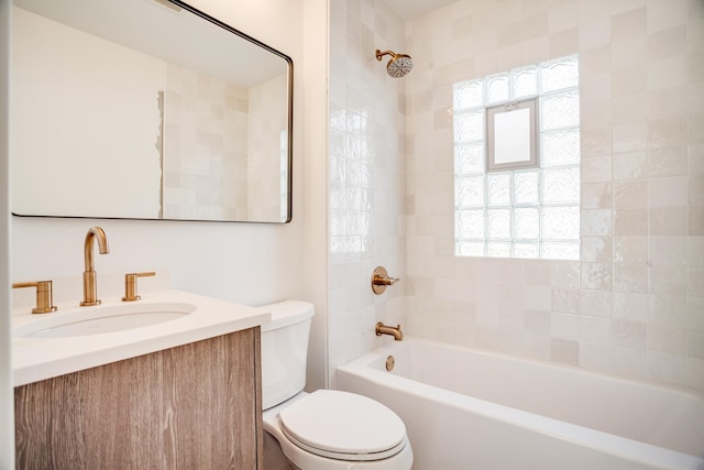 bathroom featuring shower / bath combination, toilet, and vanity