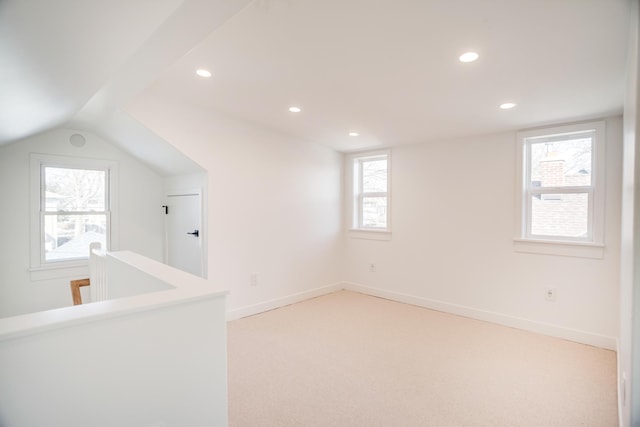 bonus room featuring vaulted ceiling, recessed lighting, baseboards, and light carpet