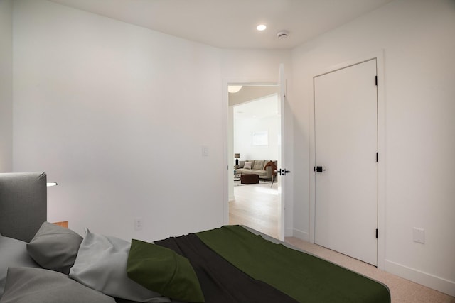 bedroom with carpet flooring, recessed lighting, and baseboards