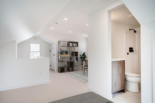 interior space with lofted ceiling, recessed lighting, baseboards, and carpet floors