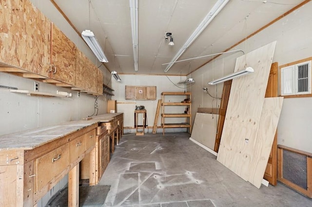 basement with a workshop area