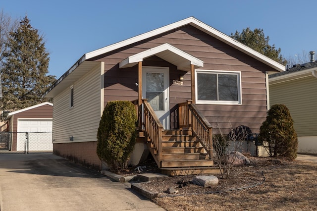 view of front of property featuring an outbuilding and a garage