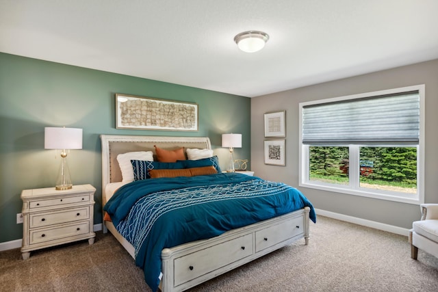 bedroom with carpet floors and baseboards