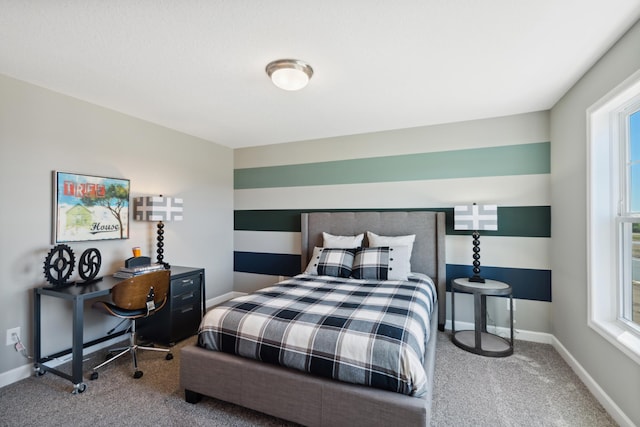 carpeted bedroom with multiple windows and baseboards