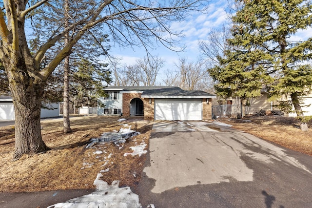 view of front of house with brick siding, concrete driveway, and an attached garage