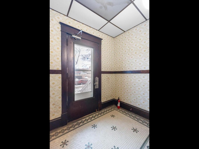 doorway featuring wallpapered walls