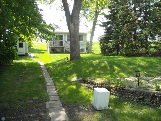 17140 Big Cormorant Rd, Lake Eunice Twp, MN 56511 - view of green lawn featuring a wooden deck