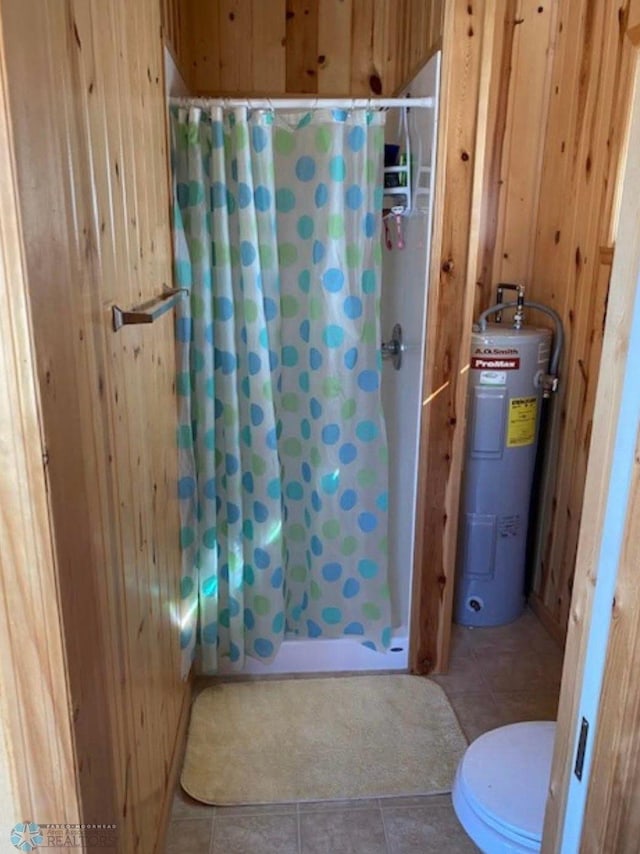 17140 Big Cormorant Rd, Lake Eunice Twp, MN 56511 - full bath with water heater, wooden walls, curtained shower, toilet, and tile patterned flooring