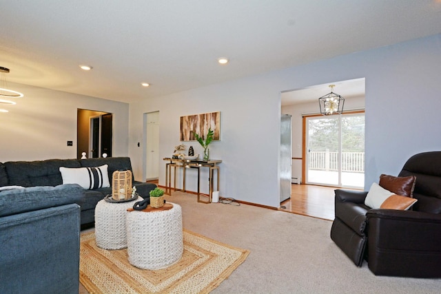 living room featuring baseboards, carpet, a chandelier, and recessed lighting