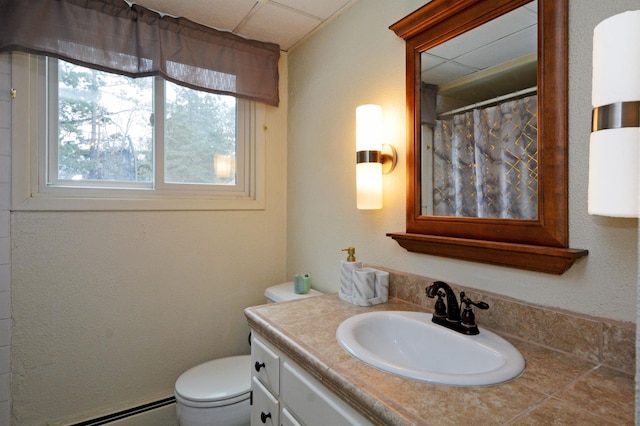 bathroom featuring a baseboard heating unit, toilet, a shower with shower curtain, and vanity