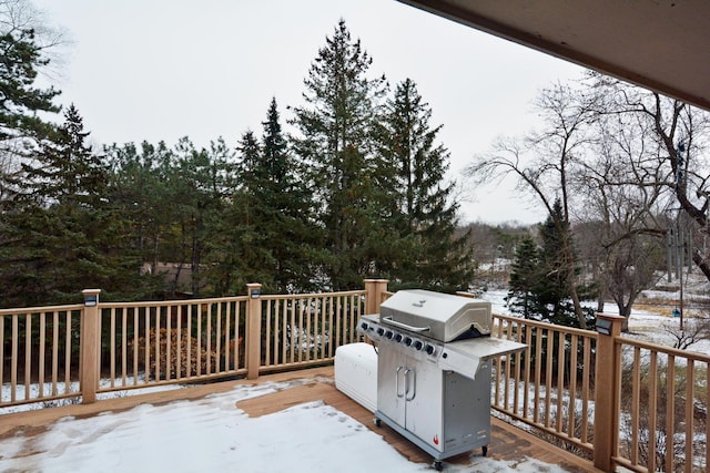 snow covered deck featuring grilling area