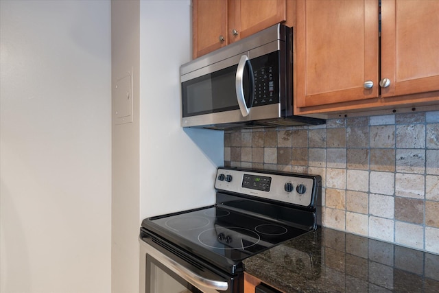 kitchen featuring stainless steel appliances, brown cabinetry, and decorative backsplash