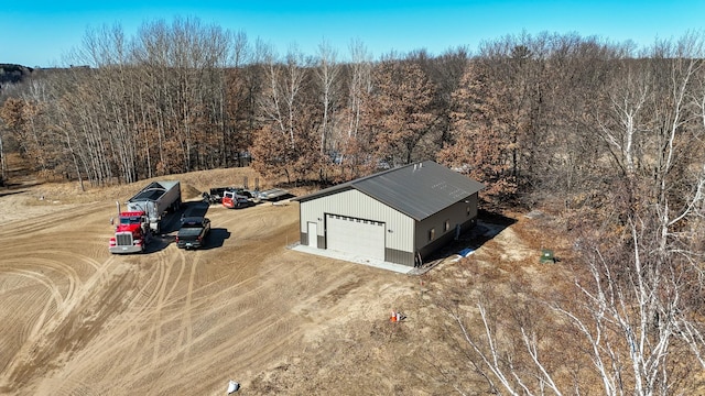 drone / aerial view with a view of trees