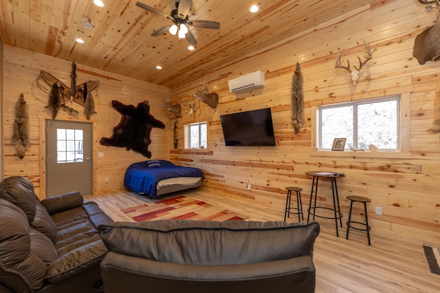 living room with an AC wall unit, wood finished floors, wood ceiling, and wooden walls