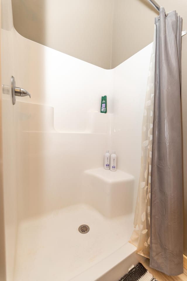 full bathroom with a shower with curtain