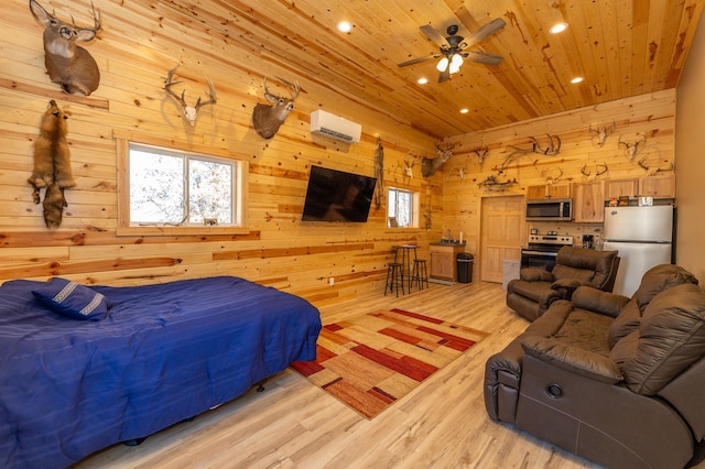 bedroom with light wood finished floors, wood ceiling, freestanding refrigerator, wood walls, and a wall mounted AC