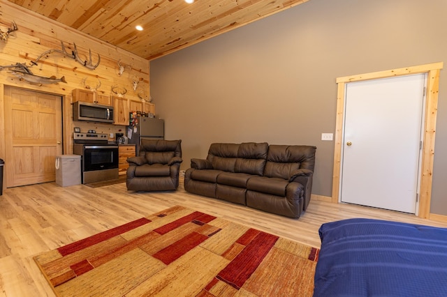 living area featuring wooden ceiling, wooden walls, high vaulted ceiling, and light wood finished floors