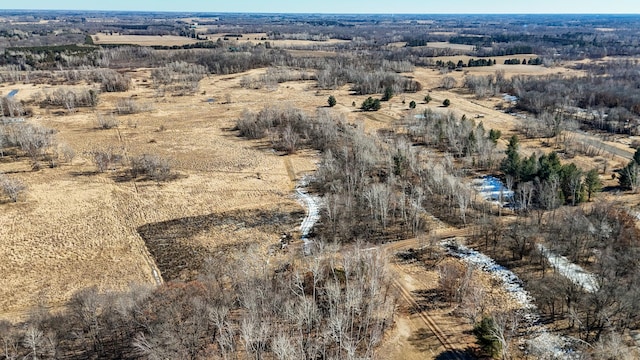 birds eye view of property with a rural view