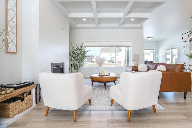 living room with recessed lighting, beamed ceiling, coffered ceiling, and light wood-style floors