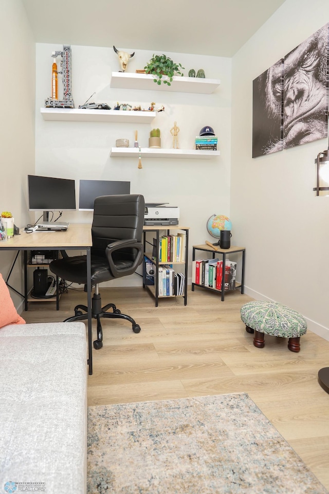 office featuring wood finished floors and baseboards