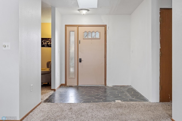 entryway featuring carpet floors