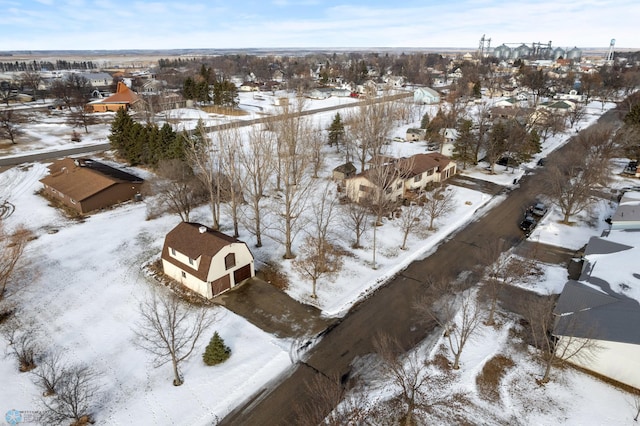 snowy aerial view featuring a residential view