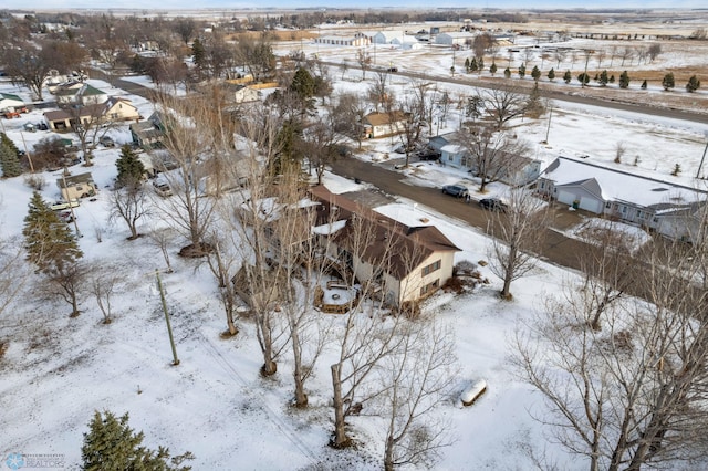 snowy aerial view featuring a residential view