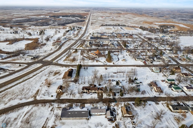 snowy aerial view with a residential view