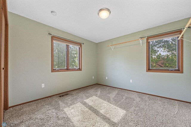 289 2nd St SW, Forman, ND 58032 - empty room featuring carpet floors and baseboards