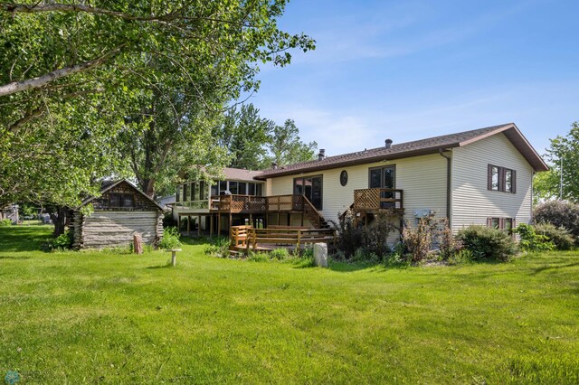 289 2nd St SW, Forman, ND 58032 - rear view of property featuring a yard and a wooden deck