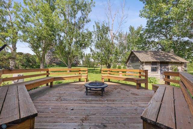 289 2nd St SW, Forman, ND 58032 - wooden terrace with an outdoor fire pit